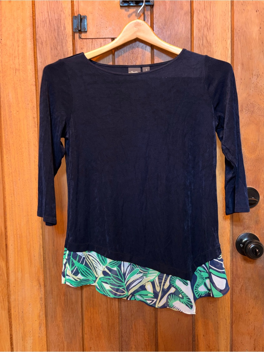 Chico’s Travelers Navy Boatneck Top with Tropical Asymmetrical Hem